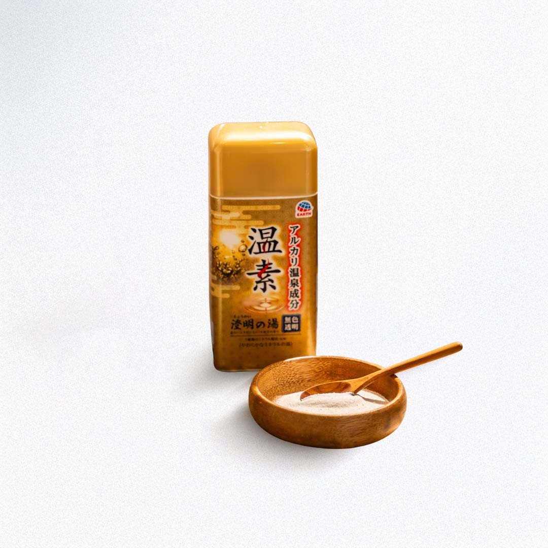 bath salt with a wooden spoon and bowl on a white background