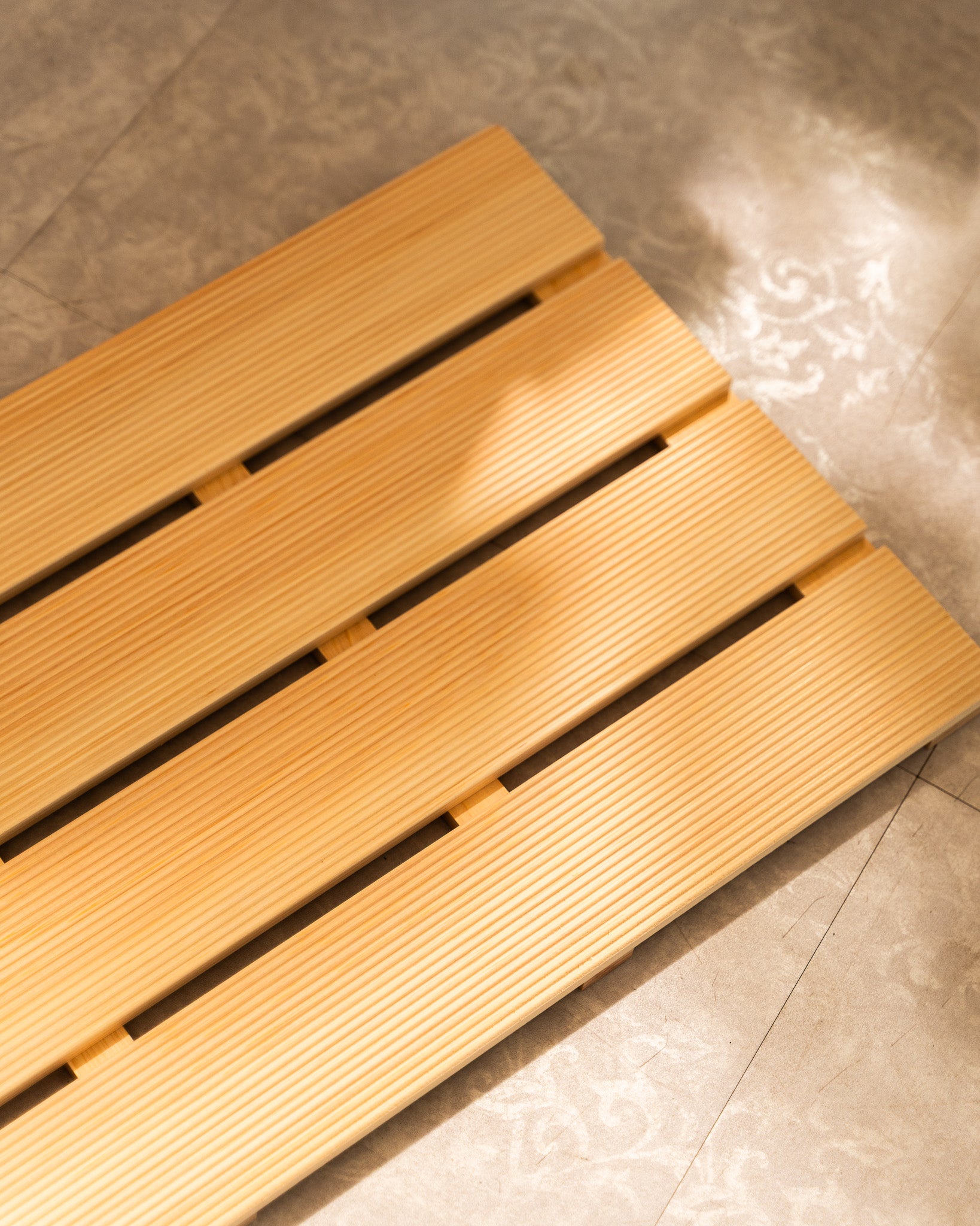 Wooden mat on a tiled floor