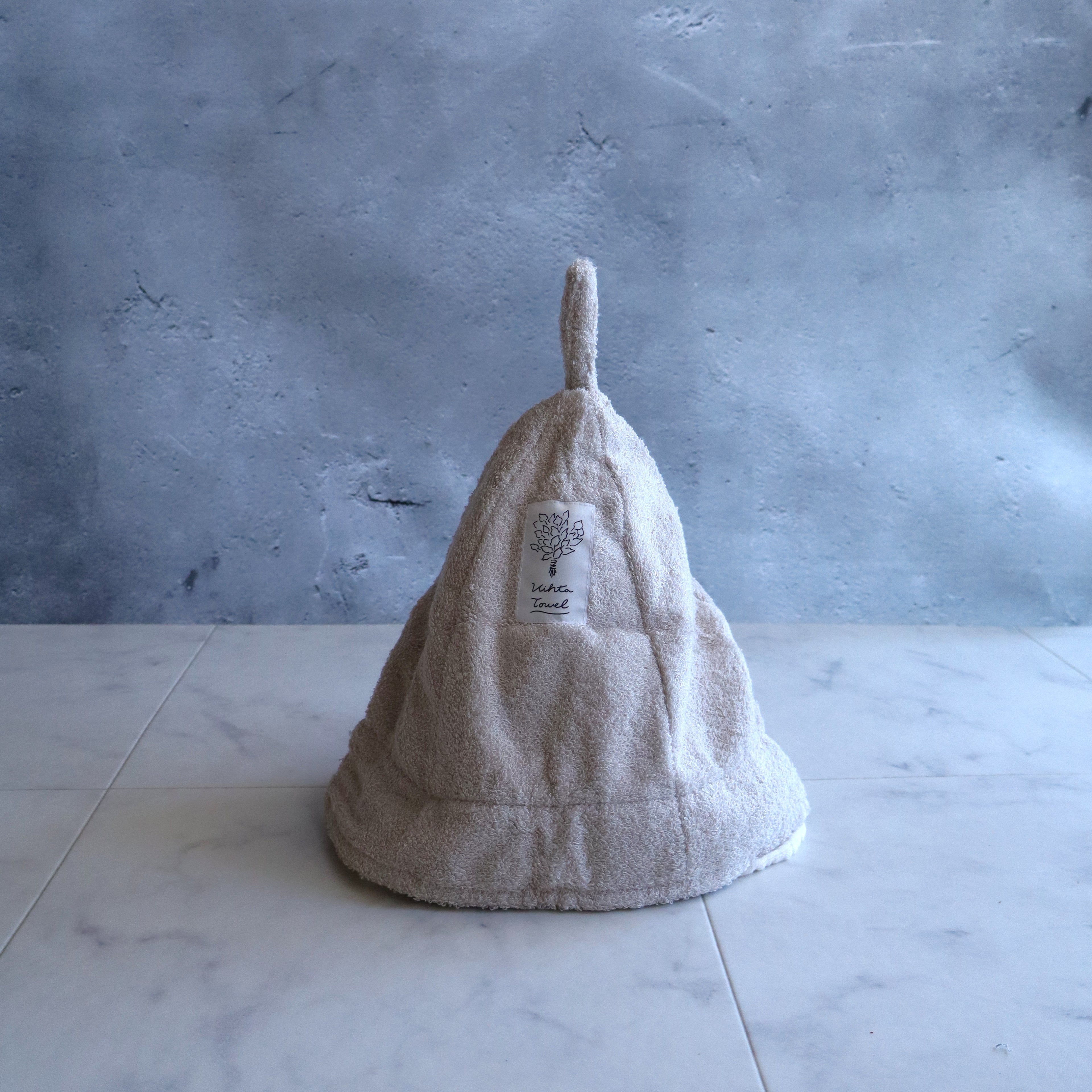 Beige sauna hat crafted by Imabari towel artisans; soft terry fabric with birch-fiber rayon blend.