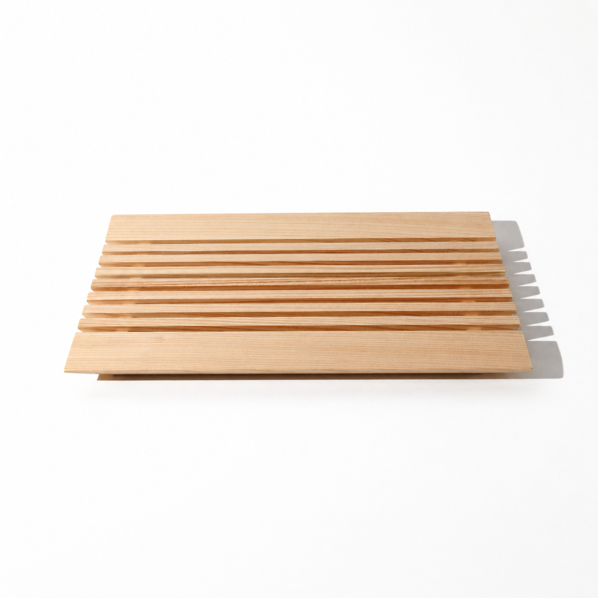 Set of wooden cutting boards with a knife on a white background