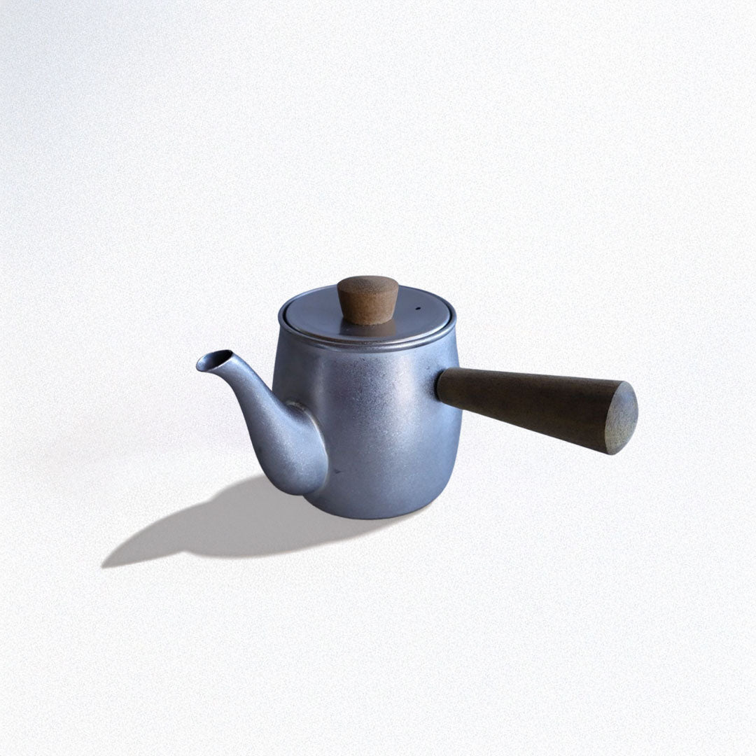 A compact Japanese-style teapot made of stainless steel with a side wooden handle and wooden knob on the lid