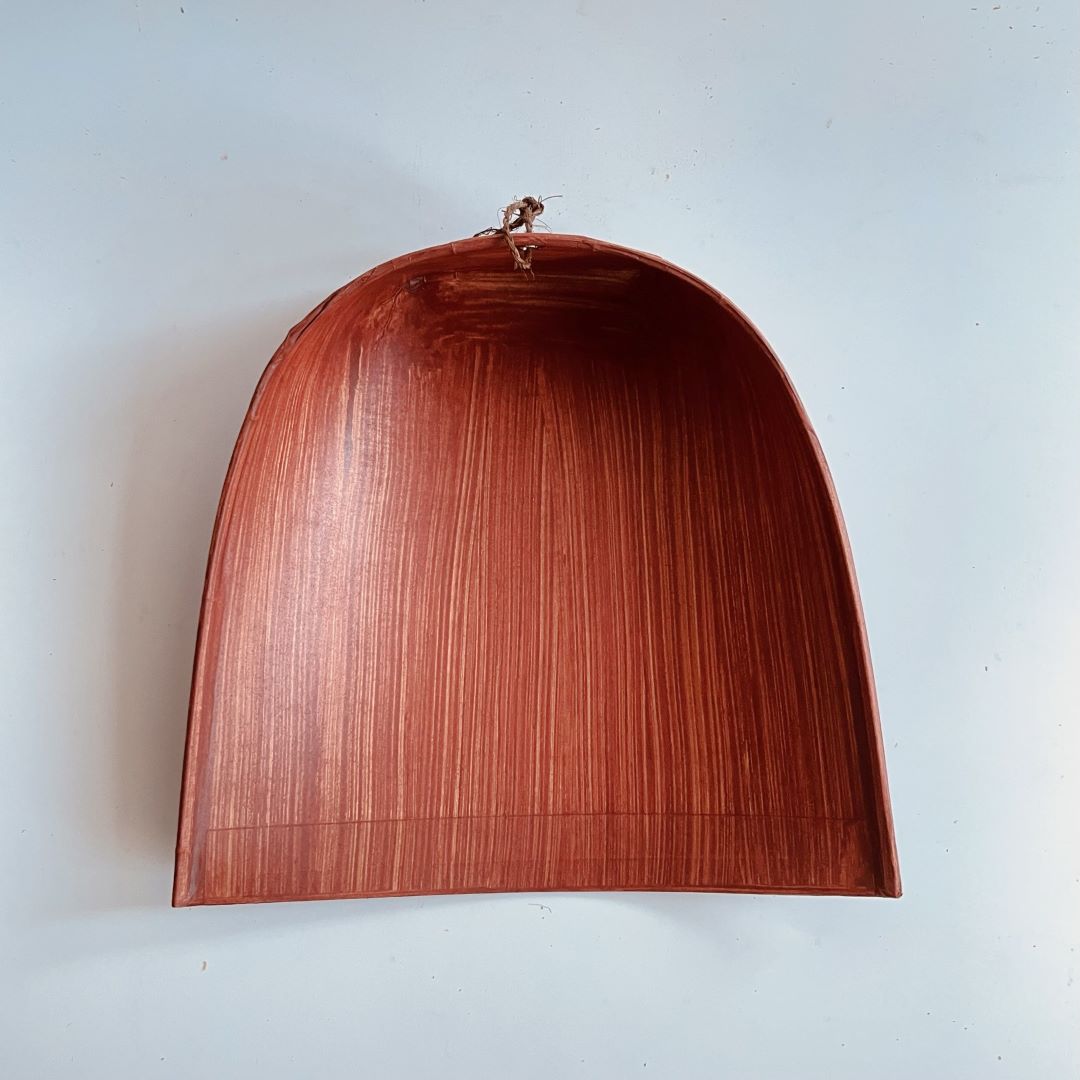 Wooden dustpan on a white background