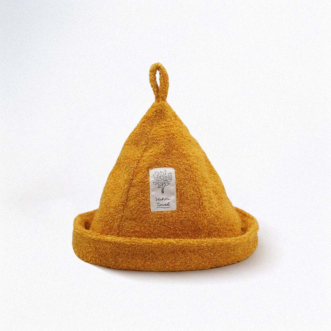 Yellow sauna hat with a brand label on a white background