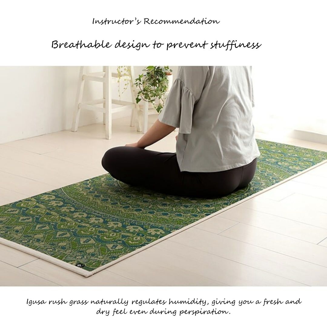Person sitting on a green patterned yoga mat in a bright room with text about the mat's features.
