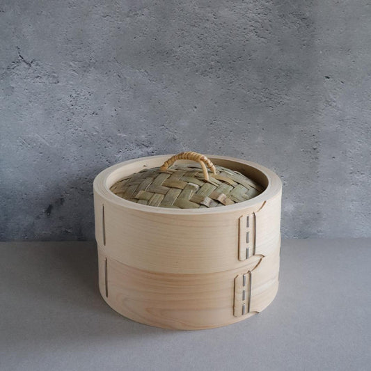 bamboo steaming basket standing in a a grey room