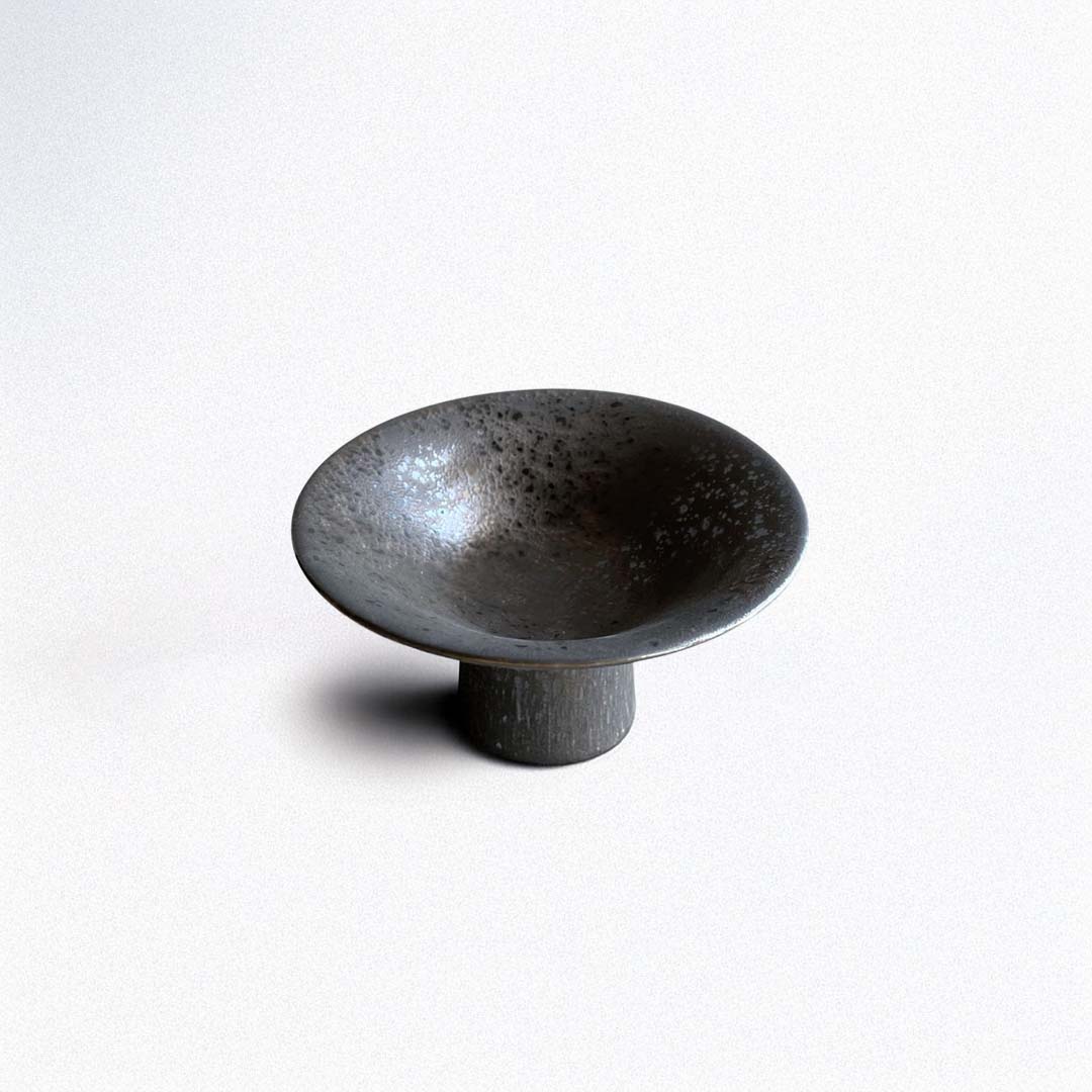 Black ceramic bowl on a white background