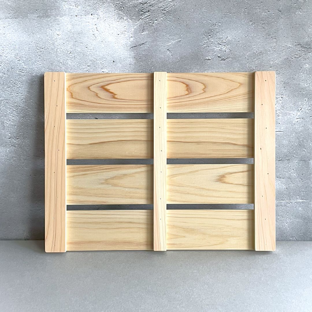 In a grey room, a wooden bathroom opposite side on a wall