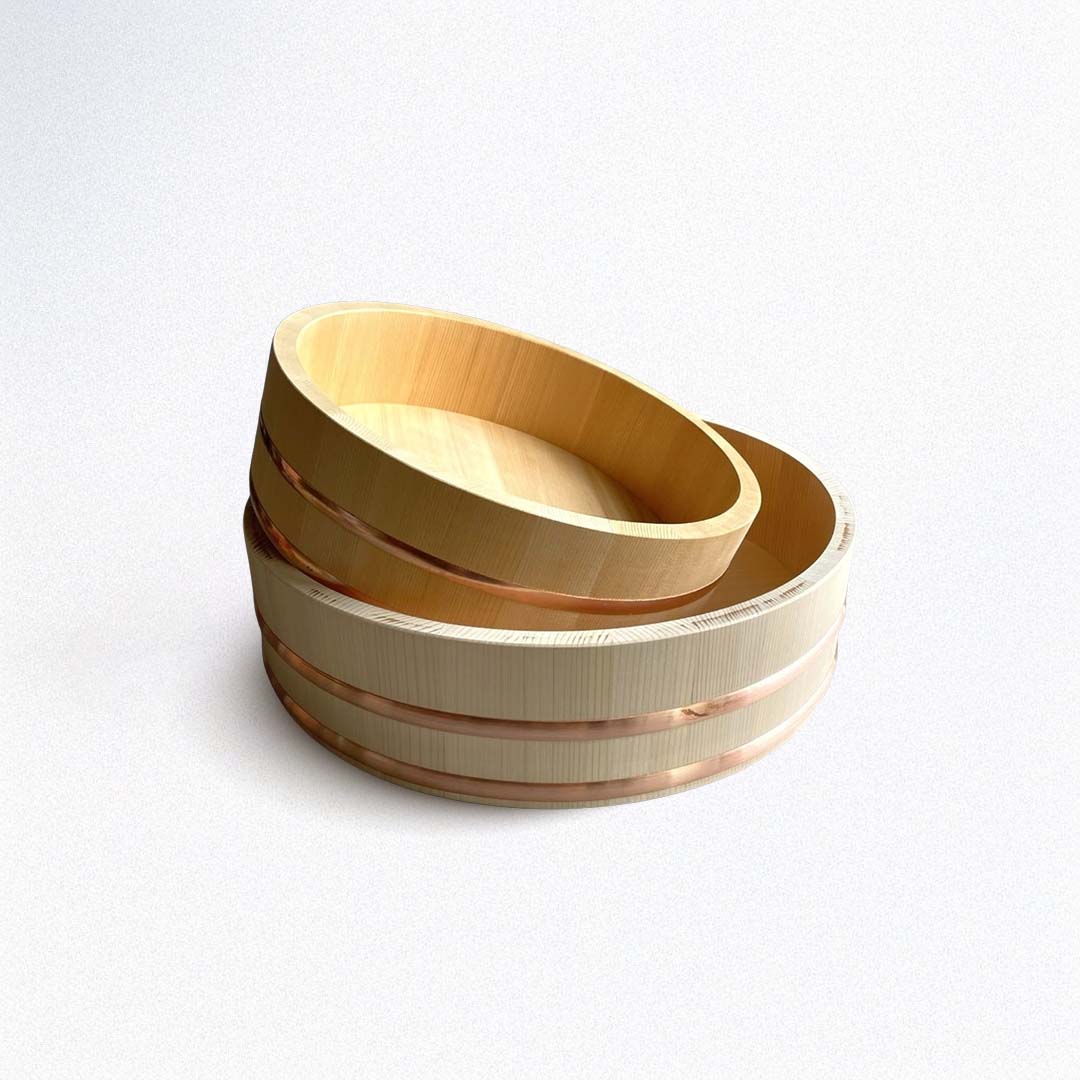 A brown wooden Hangiri sushi bucket with two copper rings around the rim on a white background