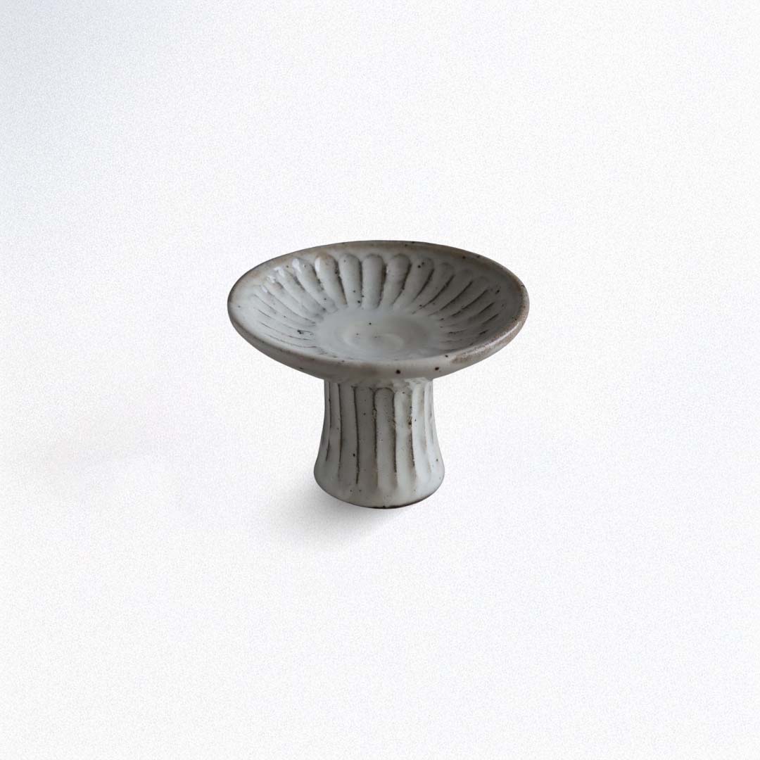 Ceramic saucer plate on a white background
