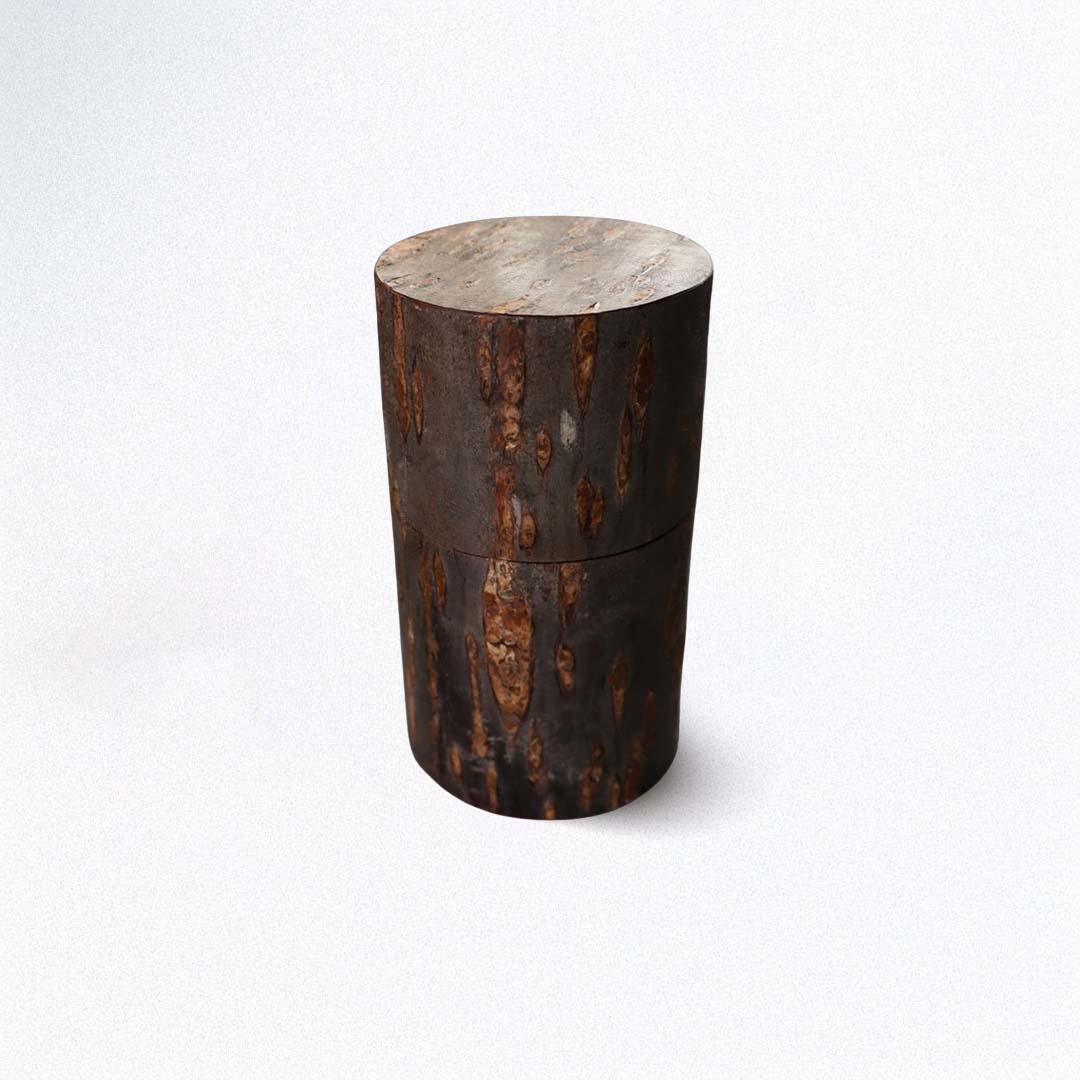 A cylindrical tea caddy on a white background