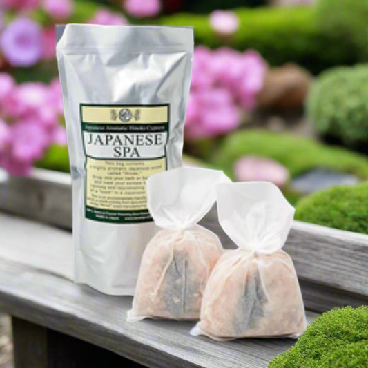 a big with japanese spa written on it and two bags of wooden hinoki wood