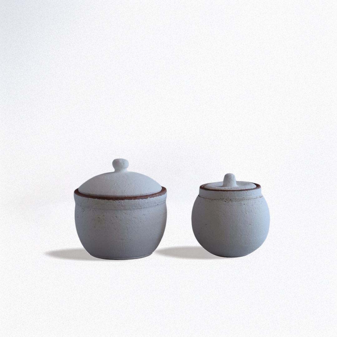 Two white handmade Japanese Shigaraki ceramic salt cellars