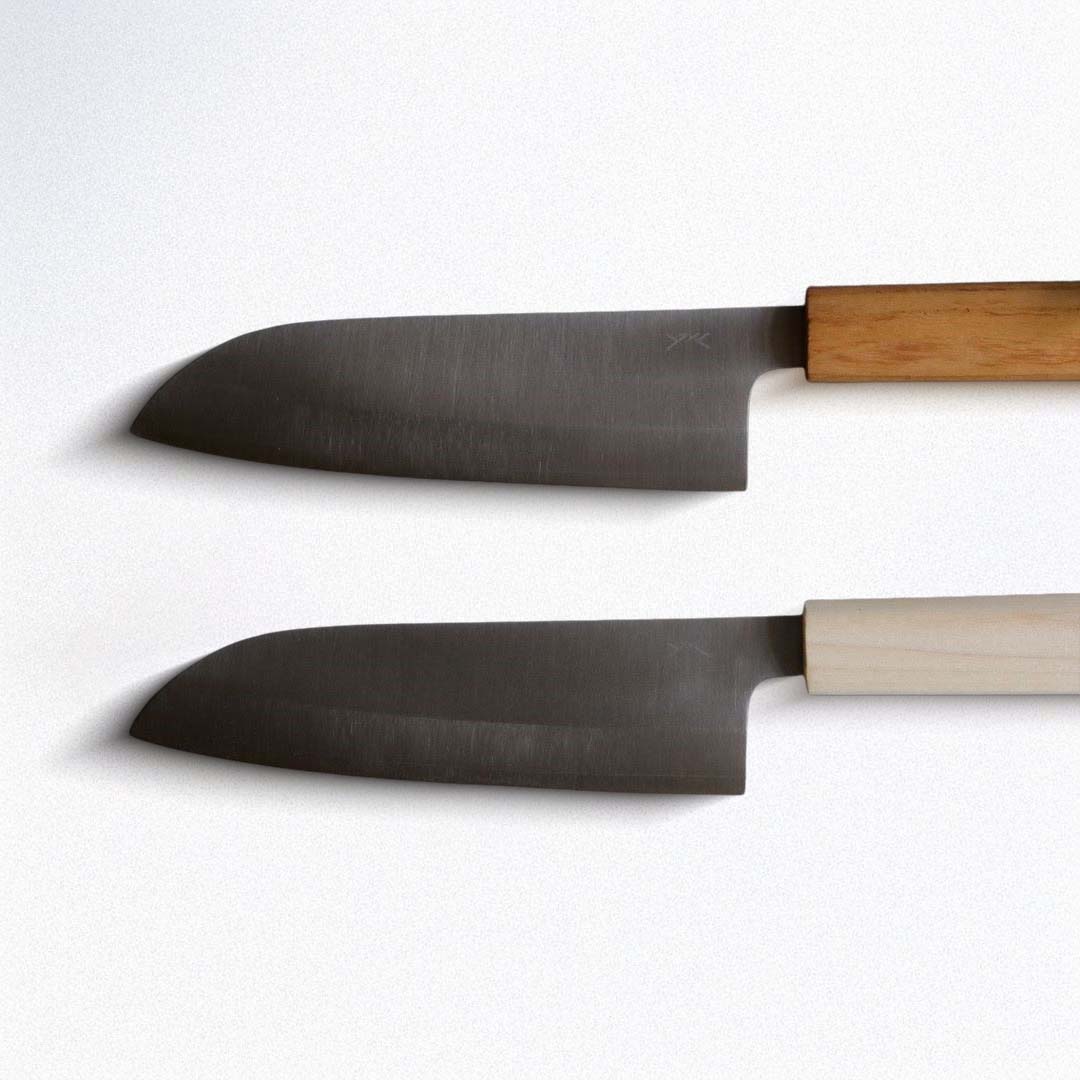 Two kitchen knives with wooden handles on a white background