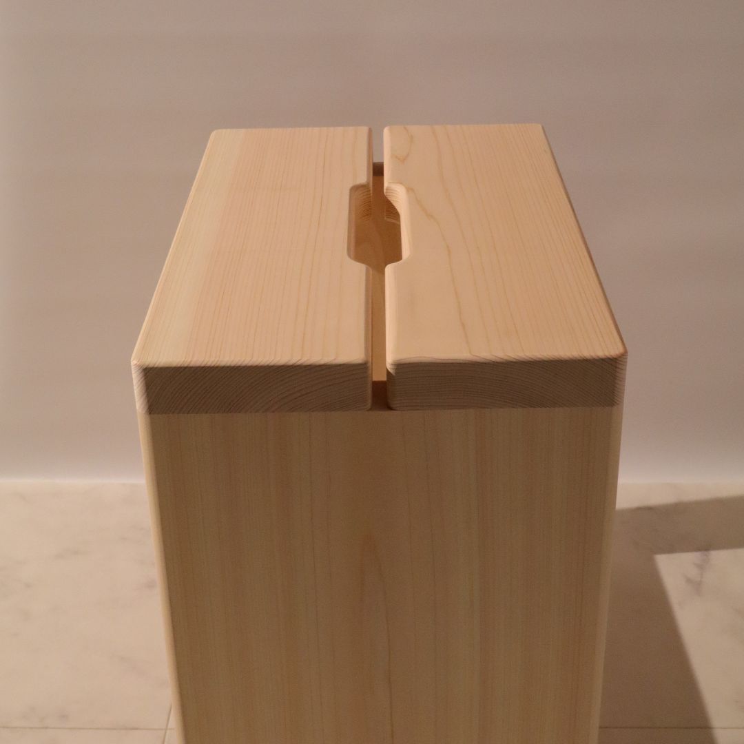 Wooden block with a dovetail joint on a neutral background