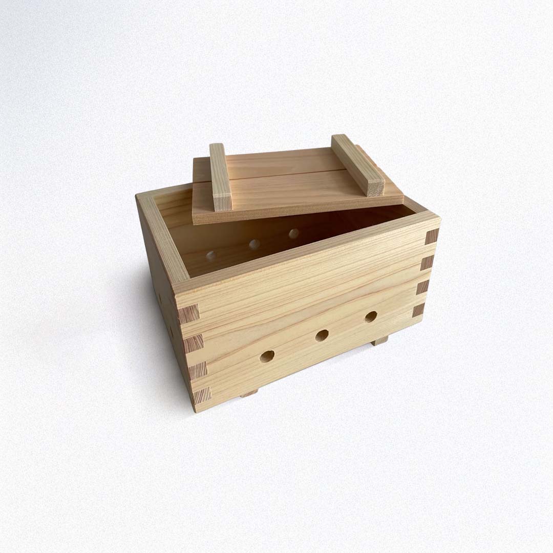 Wooden tofu maker with a lid on a white background