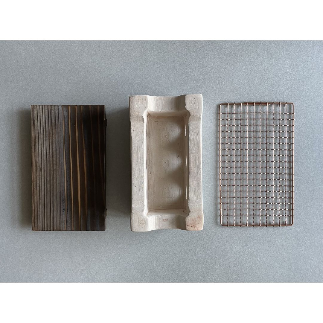 three parts of bbq wood table upper view of charcoal a nd grill