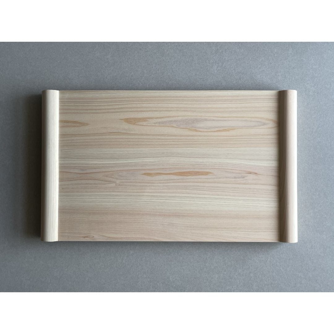 Wooden cutting board front view on a grey surface