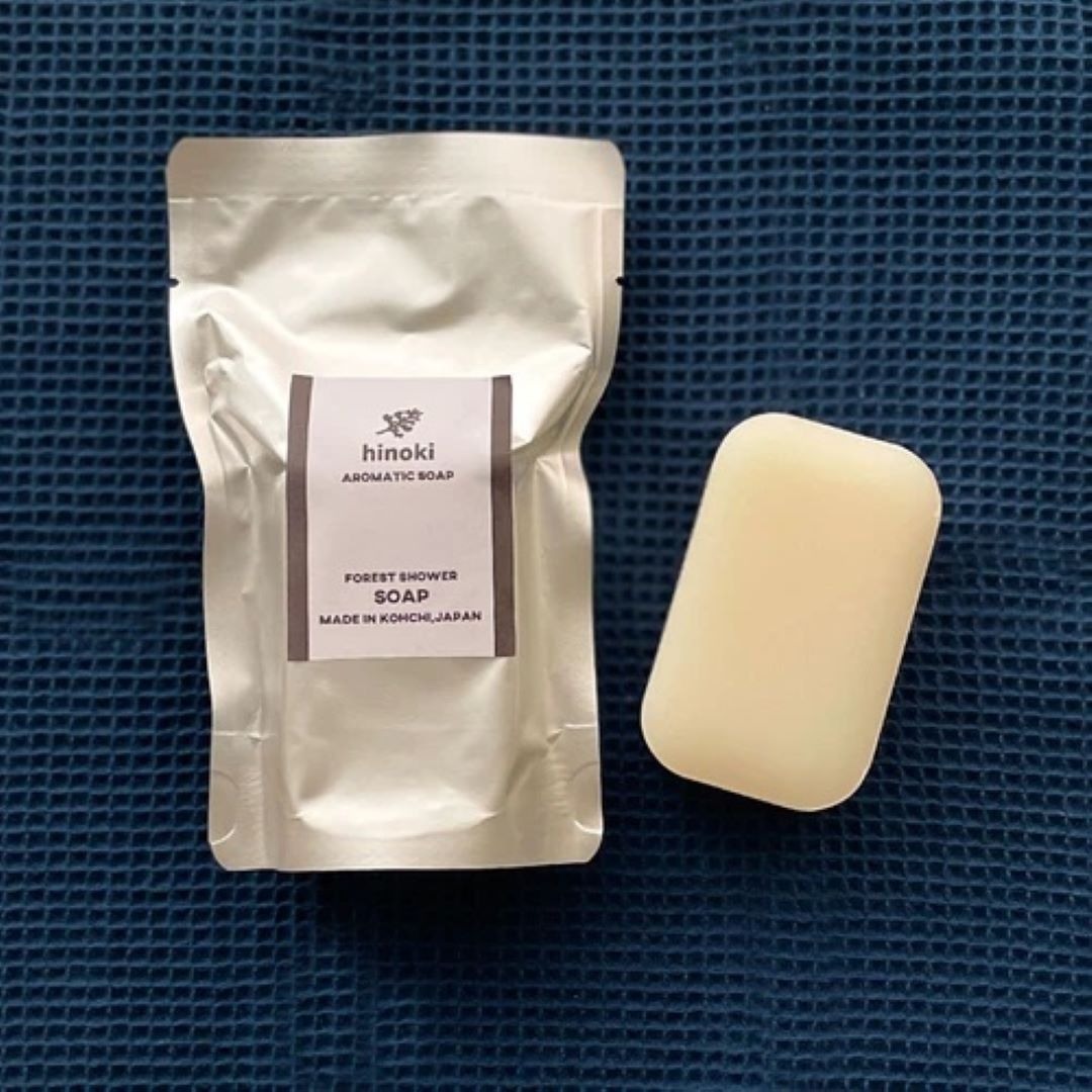 A soap bag with a soap on a blue sheet