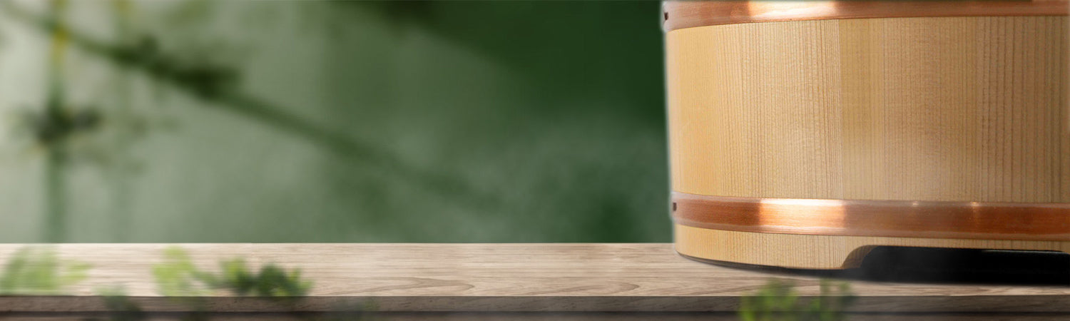 a wooden bucket in a green garden