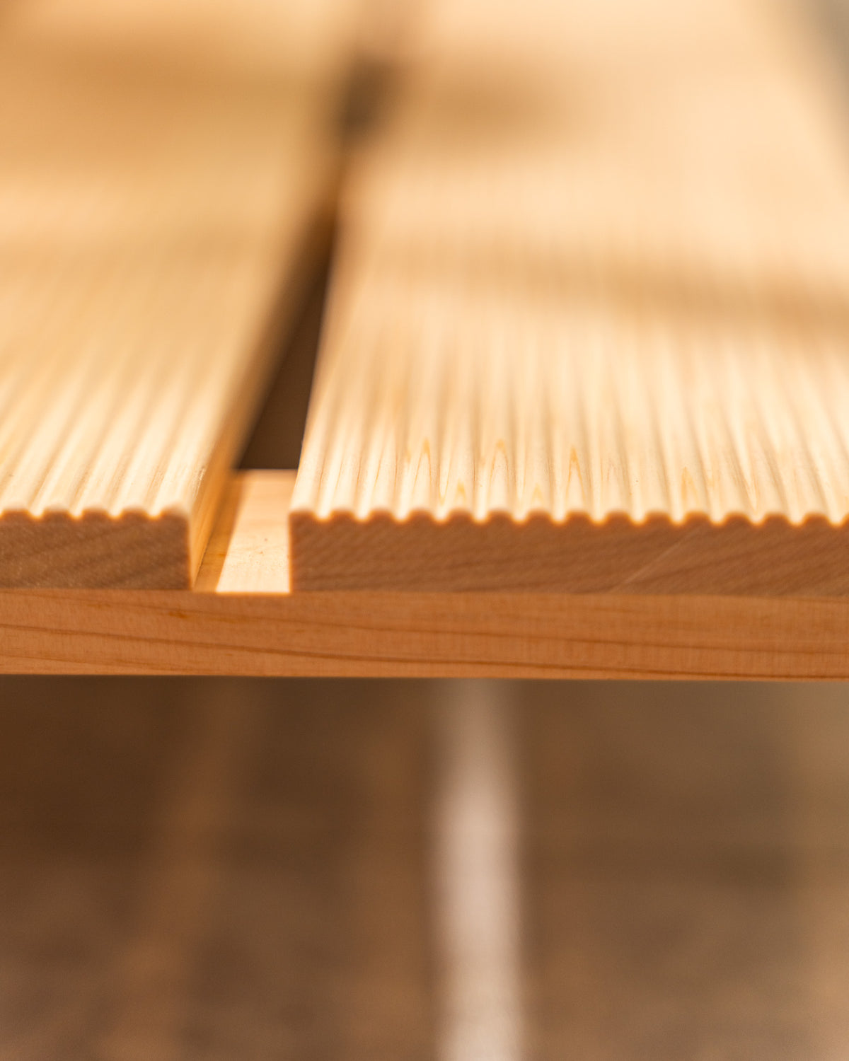 Close-up of wooden flooring with a focus on texture and grain.