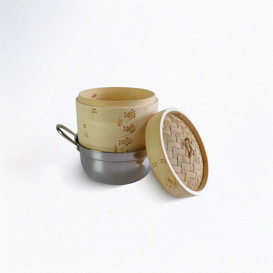 Bamboo steamer with a metal base on a white background