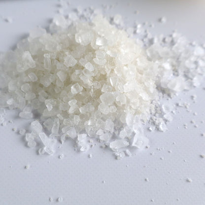 Close-up image of coarse bath salt crystals for Yuzu Bath Salt, highlighting the natural texture and appearance of the salt grains.