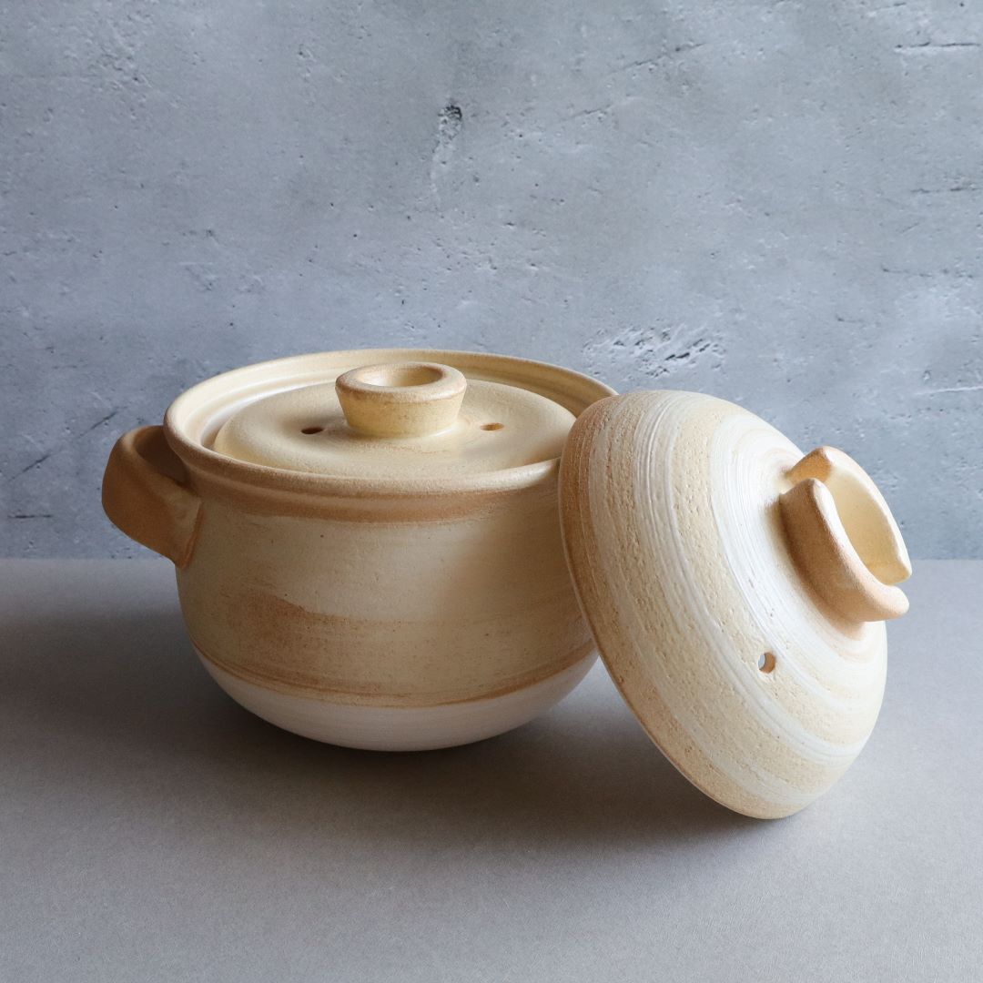 open lid of a Japanese ceramic rice cooker