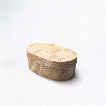 Wooden box with a woven lid on a white background