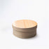 A round Japanese cedar wood lunch bento box on a white background.