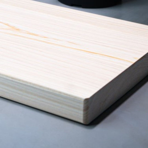 wooden cutting board in a japanese kitchen surrounded by plants