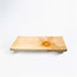 Wooden cutting board on a white background