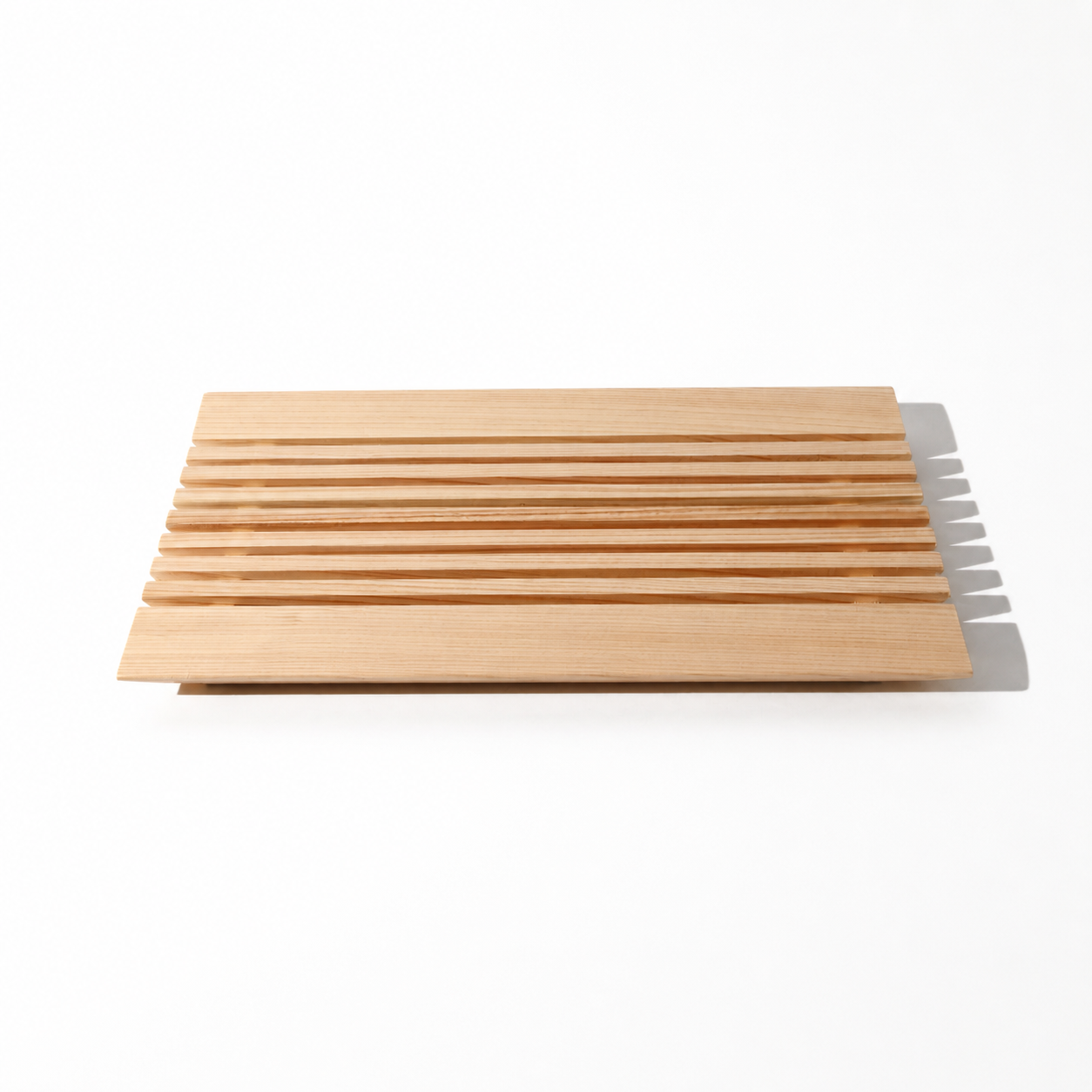 Set of wooden cutting boards with a knife on a white background