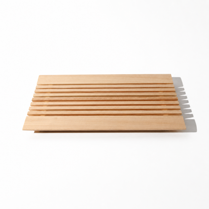 Set of wooden cutting boards with a knife on a white background