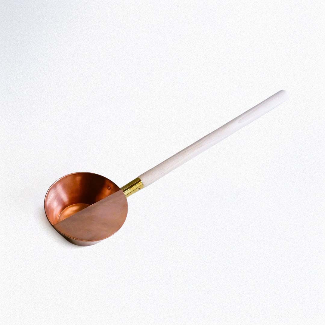 Handcrafted Japanese copper sauna ladle with a long beechwood handle