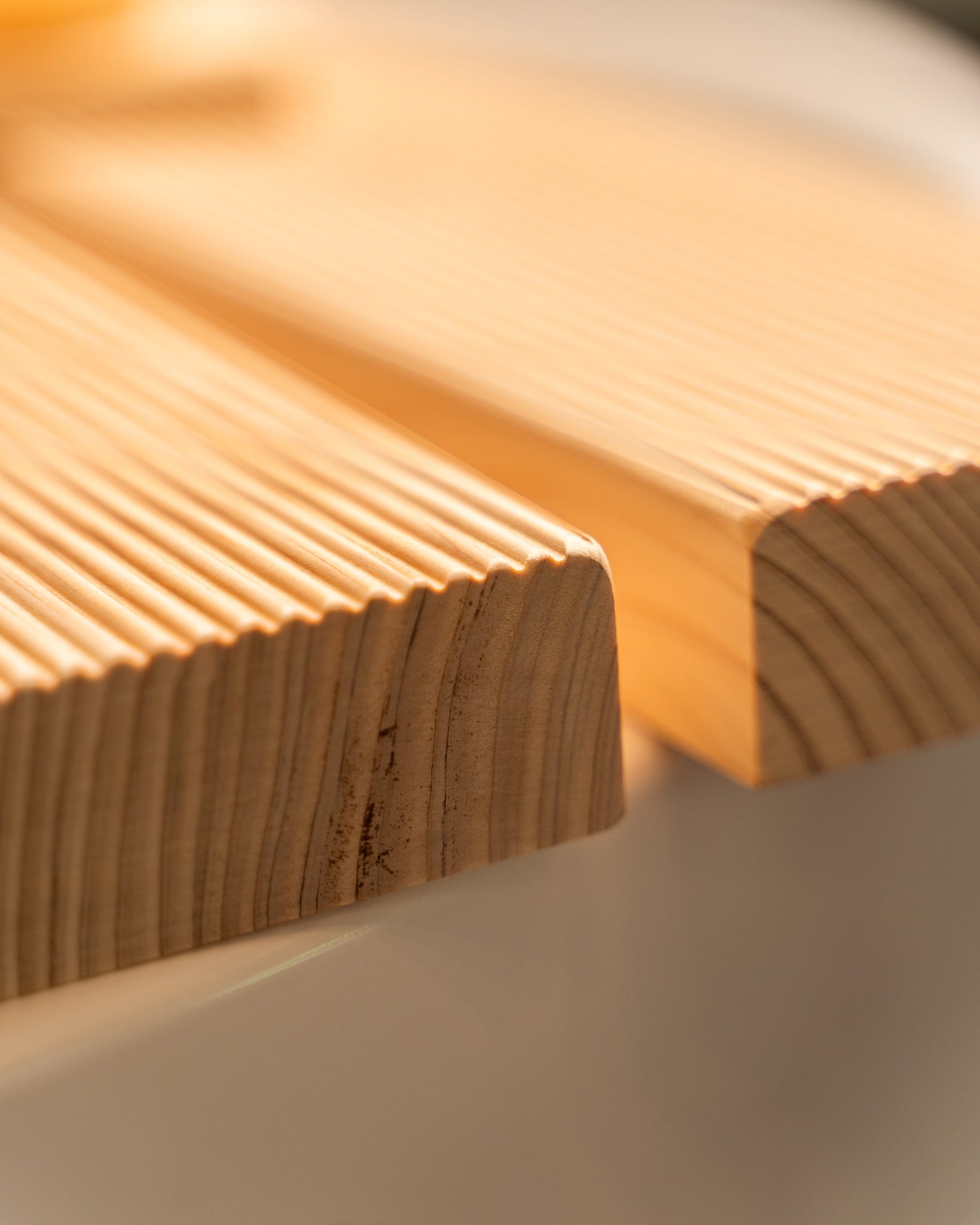 Close-up of a wooden surface with a warm glow