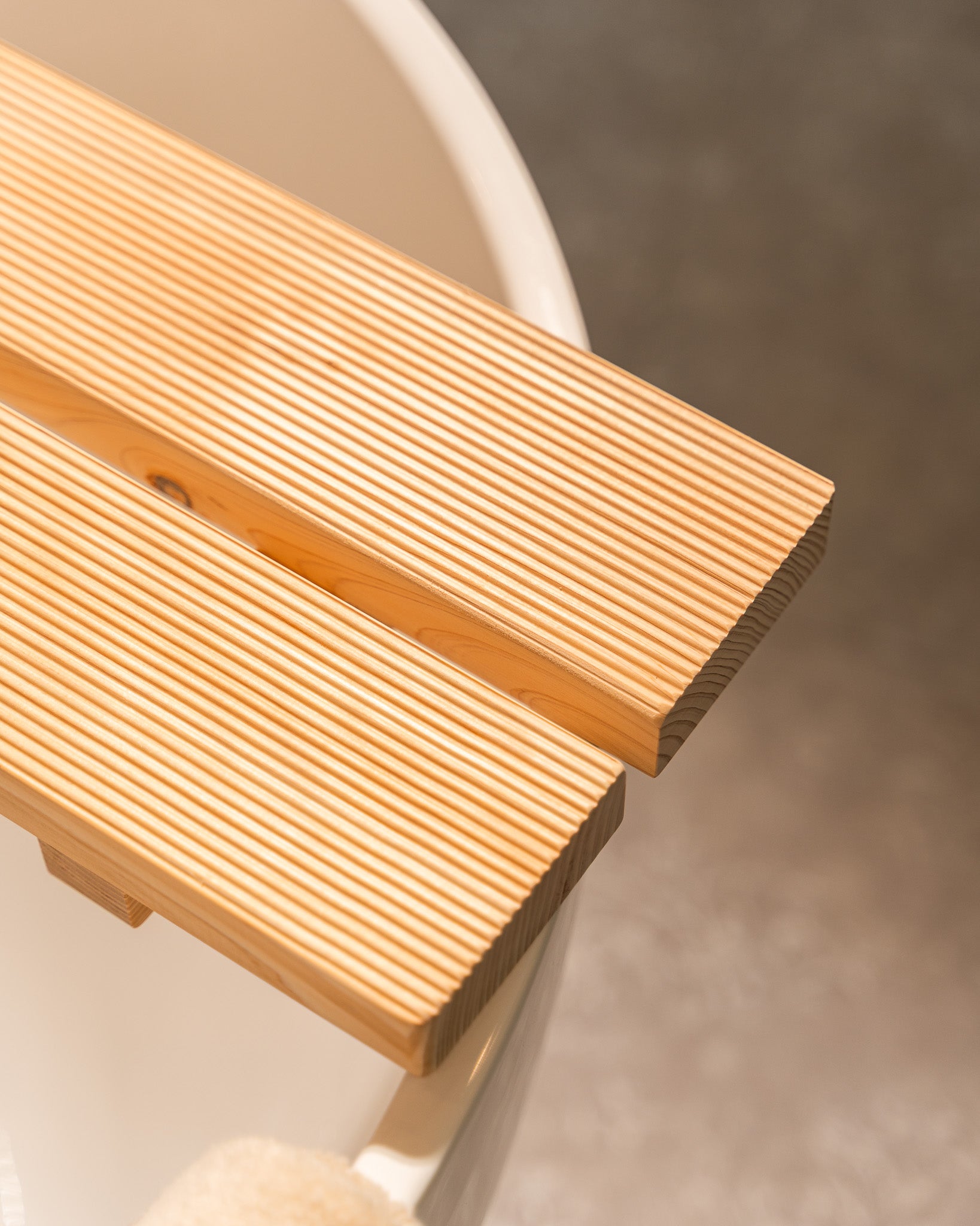 Close-up of a wooden step with a blurred background