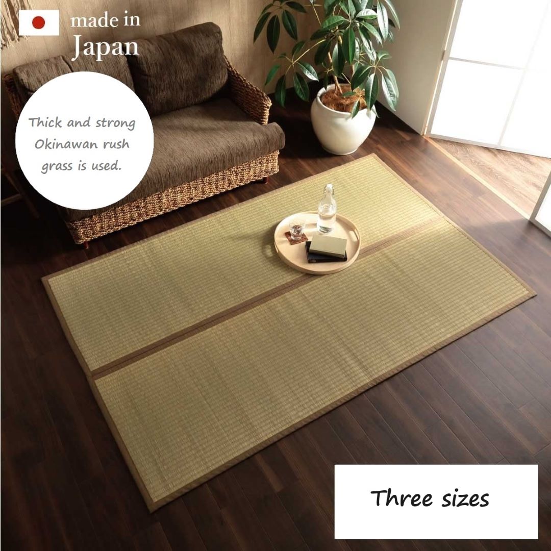 A traditional Japanese tatami mat placed on a wooden floor, with a low table and chairs set on top of the mat. 