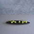 Green grapes on a black oval plate against a gray background