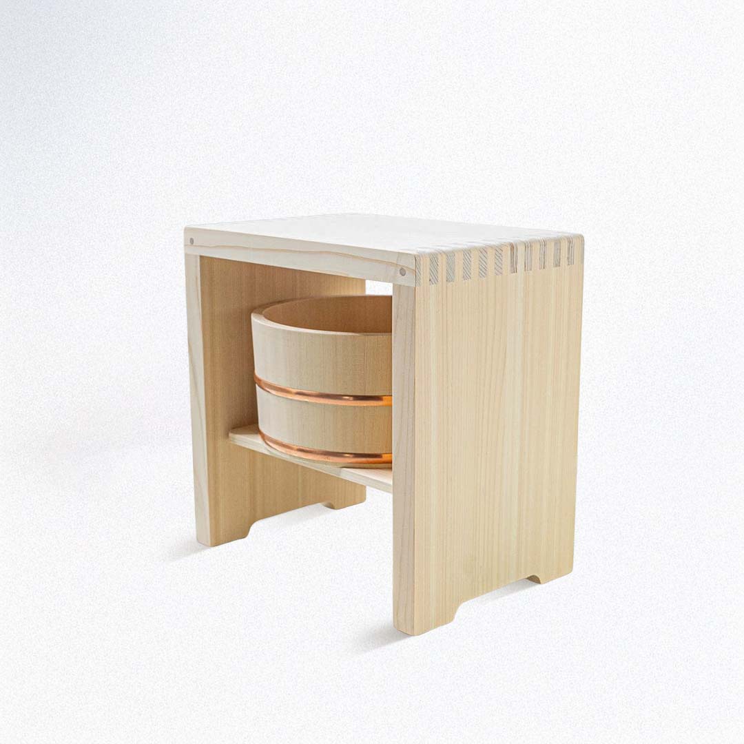 Hinoki wood bucket placed inside a Hinoki wood stool.