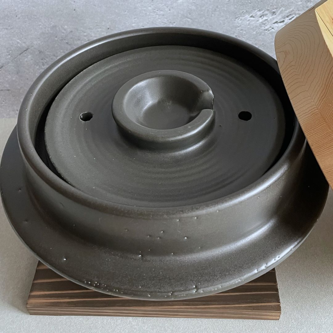 Japanese handmade rice cooker, top lid of a black clay pot