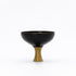 Black Sake cup with a gold base on a white background
