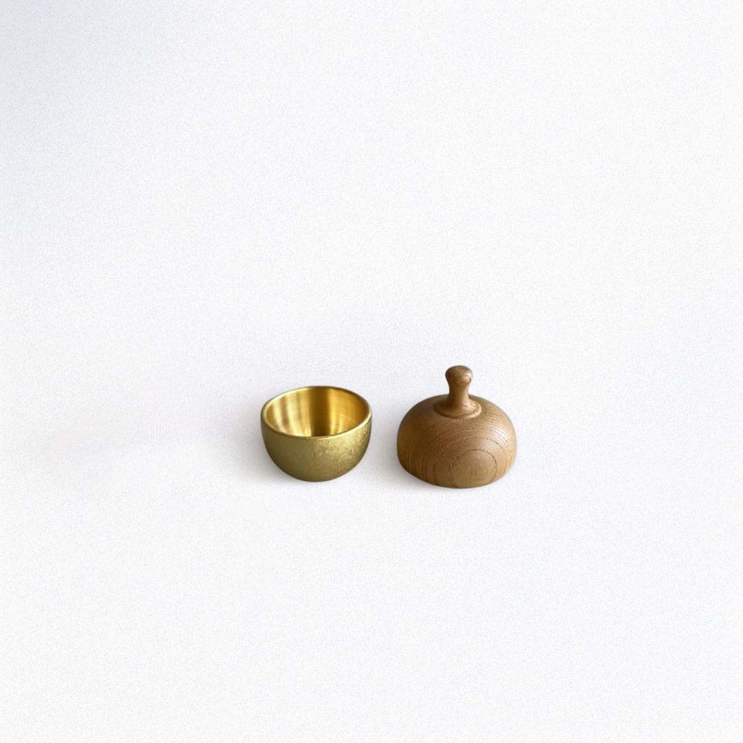 open healing bell with the top part next to the bowl