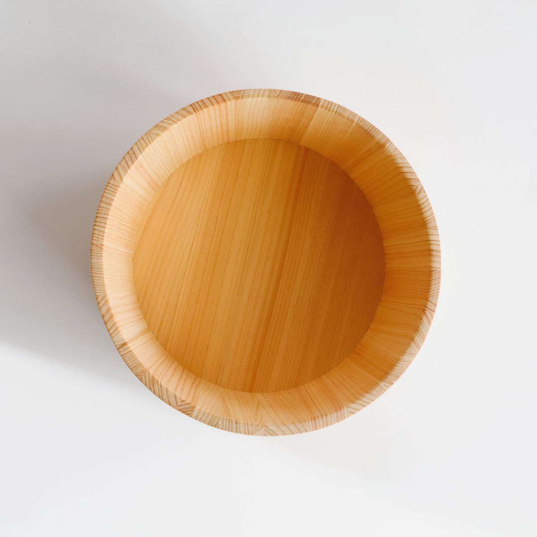 A round wooden bath bucket with a smooth, light tan finish, photographed from directly above on a clean white background.