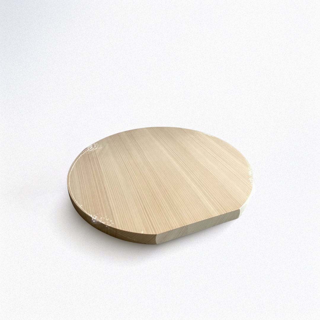 Round wooden cutting board on a white background