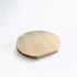 Round wooden cutting board on a white background