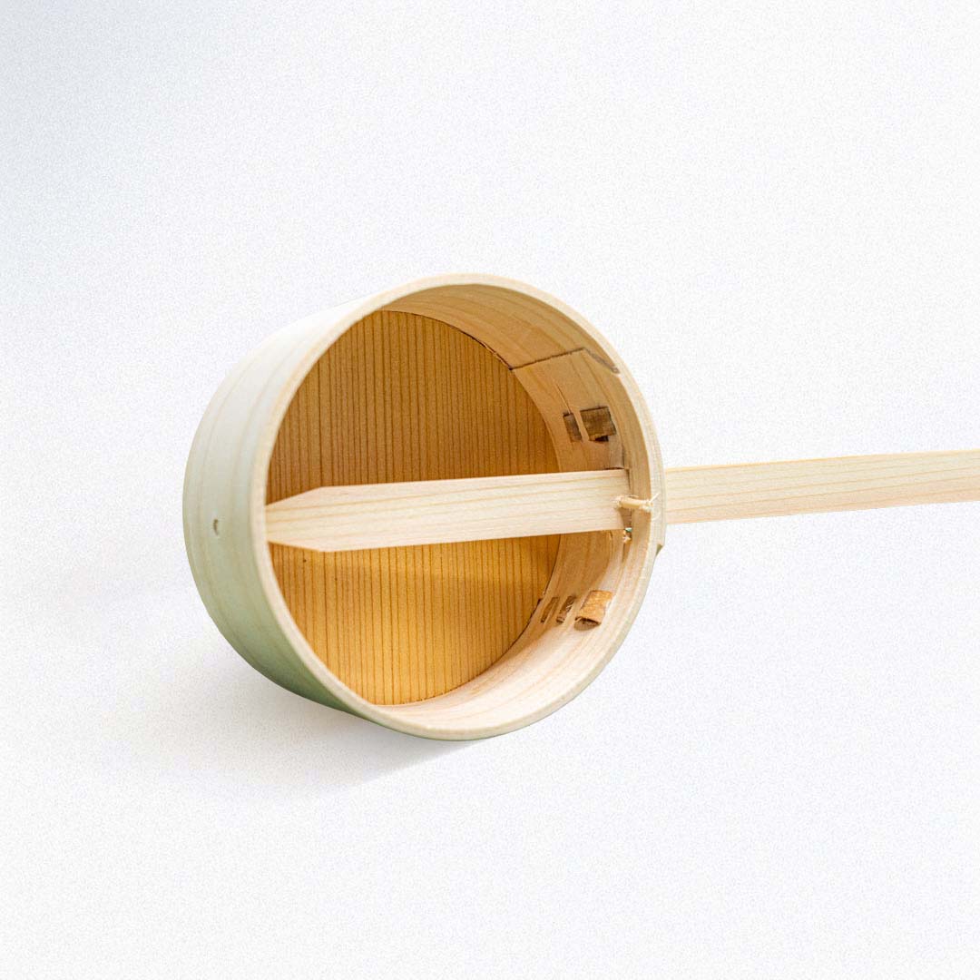 Wooden ladle on a white background