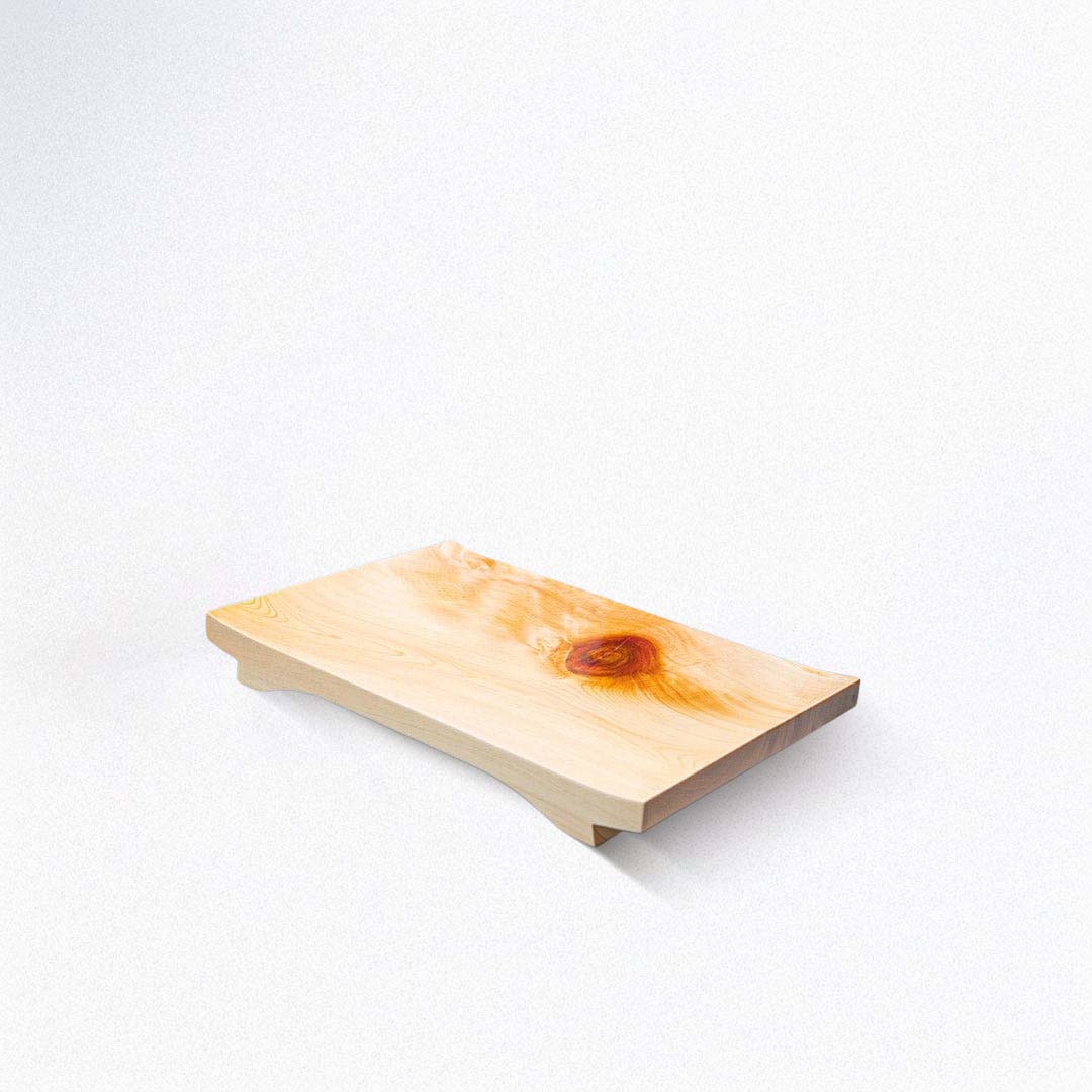 Wooden cutting board with a natural finish on a white background
