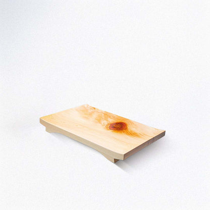 Wooden cutting board with a natural finish on a white background