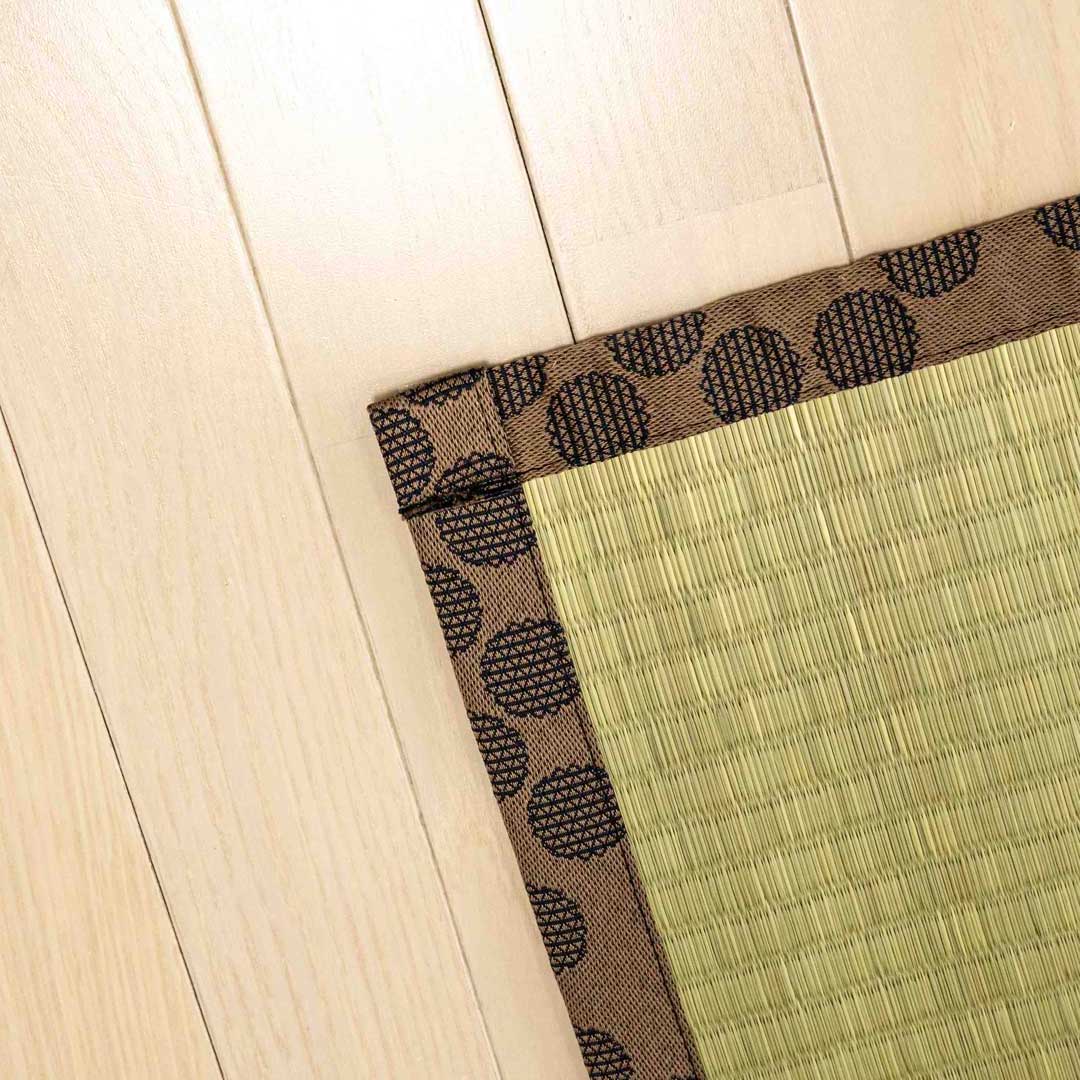 a corner of a brown colour japanese tatami Ando placed on a wooden floor