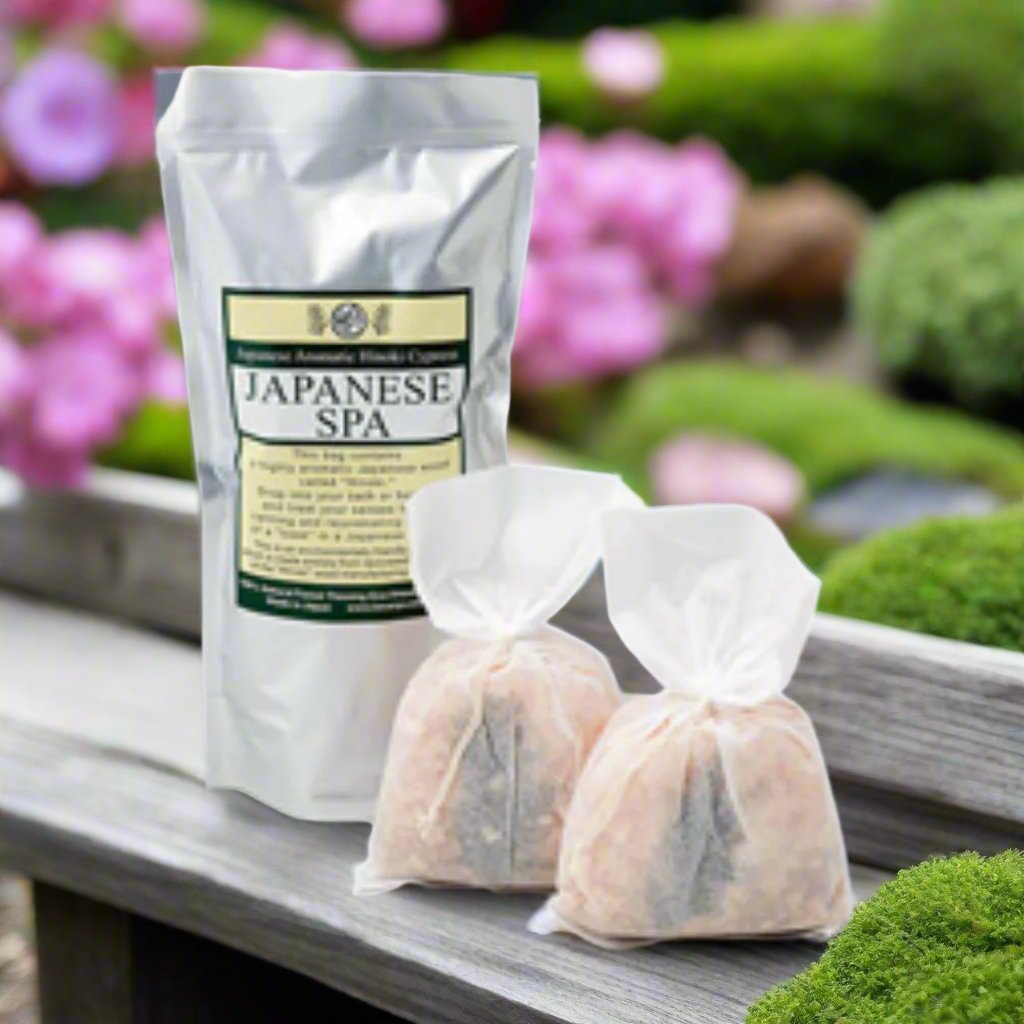 a big with japanese spa written on it and two bags of wooden hinoki wood